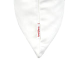 Weisse Kissenhuelle ca. 25x35 cm – Winterdeko mit orangen, gefrosteten Rosen, Kieferzapfen und Zweigen. Detailansicht des beties Label  – 100% Baumwolle – Aus der beties Magie des Winters "Frost-Rose" Kollektion.